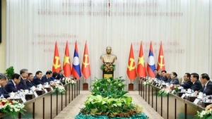 General Secretary To Lam and General Secretary and President of Laos Thongloun Sisoulith co-chaired the high-level meeting between the CPV and the LPRP. (Photo: Thong Nhat/VNA)