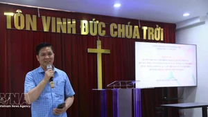 Pastor Nguyen Huu Mac, Rector of the Ha Noi Bible College, speaks at the event (Photo: VNA)