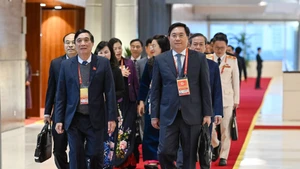 Delegates from the Phu Tho Provincial Party Committee delegation arrive to attend the session. (Photo: TRAN HAI)