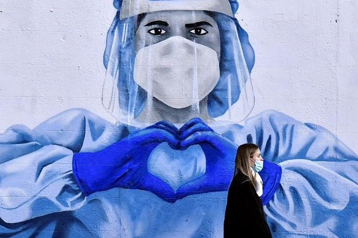 The pandemic remains a global emergency but the end could be in sight if countries use the tools at their disposal, a spokesperson for the World Health Organisation said.