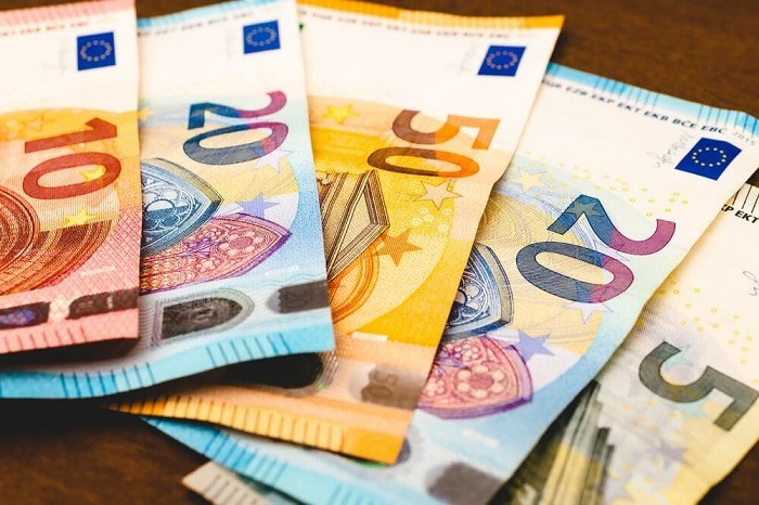 The Italian government on Tuesday cut its growth forecast for this year and next, reflecting an uncertain international outlook, and said public debt was set to rise despite its efforts to curb the annual budget deficit.
