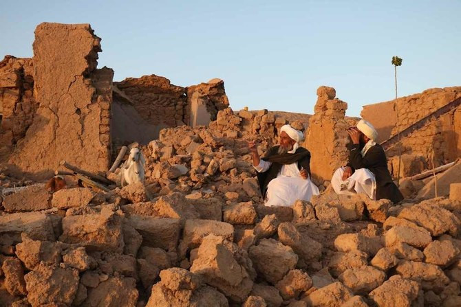 Afghan residents sit at a damaged house after earthquake in Sarbuland village of Zendeh Jan, district of Herat province on Oct. 7,2023. (Photo: AFP)