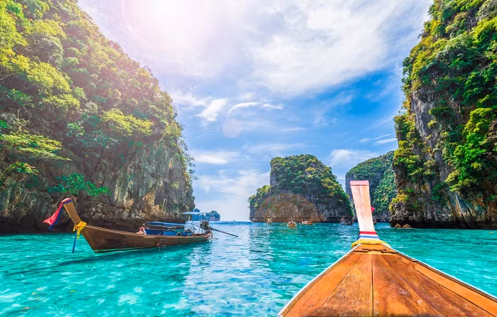 Thailand's economy continued to recover in December, driven by tourism, despite a global economic slowdown, the central bank said on Tuesday.