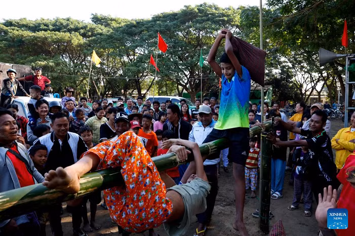 Children compete in a pillow-fighting game during an event marking the 77th Anniversary of Independence Day in Nay Pyi Taw, Myanmar, Jan. 4, 2025. Myanmar on Saturday celebrated the 77th Anniversary of Independence Day with various events being held across the country. (Photo: Xinhua)