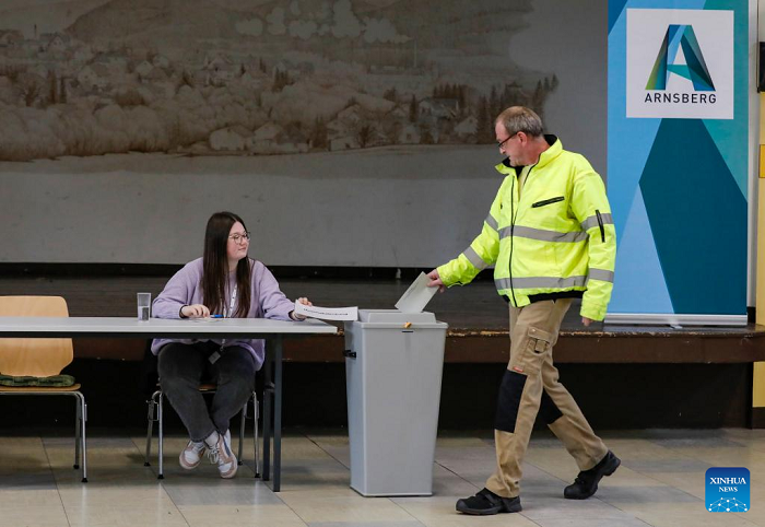 A voter casts his ballot at a polling station in Arnsberg, Germany, Feb. 23, 2025. German voters went to polls Sunday to decide the composition of the next Bundestag, the country's lower house of parliament. (Photo: Xinhua)