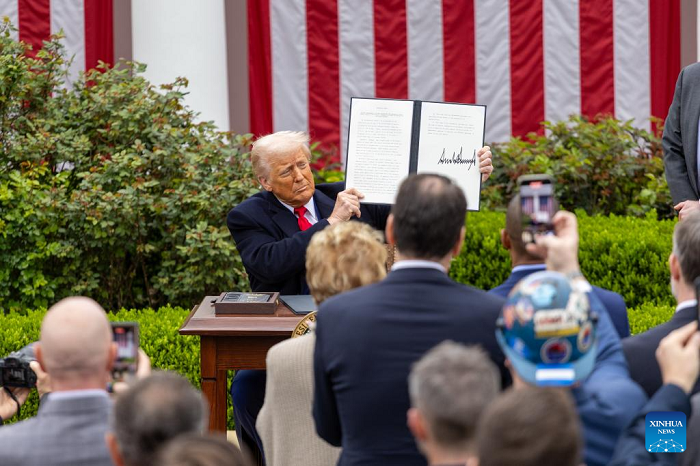 US President Donald Trump shows an executive order on "reciprocal tariffs" at the Rose Garden of the White House in Washington, D.C., the United States, on April 2, 2025. (Photo: Xinhua)
