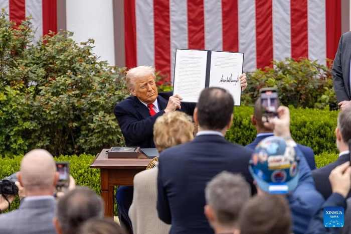 US President Donald Trump shows an executive order on "reciprocal tariffs" at the Rose Garden of the White House in Washington, D.C., the United States, on April 2, 2025. (Photo: Xinhua)