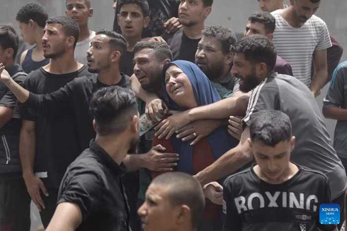 Palestinians mourn at a site of an Israeli airstrike in Jabalia refugee camp in northern Gaza Strip, on May 17, 2025. At least 64 Palestinians were killed in Israeli attacks on the Gaza Strip on Saturday, the Civil Defense in Gaza said. (Photo: Xinhua)