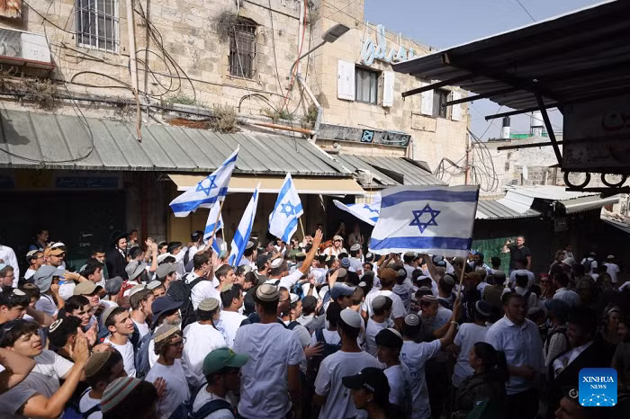 Far-right Israeli activists take part in a flag march to mark Jerusalem Day in Jerusalem's Old City, on May 26, 2025. Crowds of young far-right Israeli activists attacked Palestinians in East Jerusalem's Old City on Monday as they marched through the narrow streets to mark Israel's occupation of the eastern part of the city. (Photo: Xinhua)