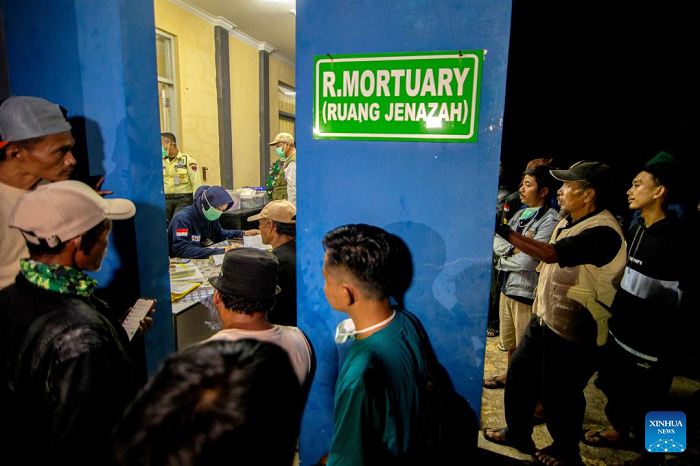 A police officer collects data from relatives of the injured and victims of an ammunition disposal blast at a hospital in Garut Regency, West Java, Indonesia, May 12, 2025. At least 13 people were killed when the Indonesian army destroyed expired ammunition in West Java province on Monday, a military officer said. (Photo: Xinhua)