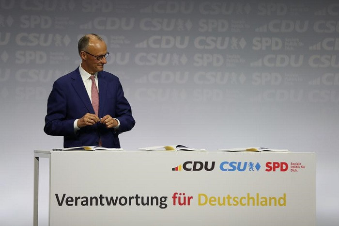 The Christian Democratic Union (CDU) Friedrich Merz signs a coalition agreement in Berlin, Germany, May 5, 2025. Friedrich Merz was sworn in as Chancellor on Tuesday during a session of the Bundestag, the country's lower house of parliament. (Photo: Xinhua)