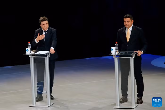 George Simion (R), chairman of the Alliance for the Union of Romanians, and Bucharest Mayor Nicusor Dan attend a TV debate in Bucharest, Romania, May 8, 2025. George Simion and Nicusor Dan will advance to the runoff of Romania's presidential election rerun, scheduled for May 18. (Photo: Xinhua)