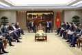 Standing Deputy Prime Minister Pham Gia Tuc (right) receives US Deputy Secretary of State Christopher Landau in Ha Noi on June 10 (Photo: VGP)