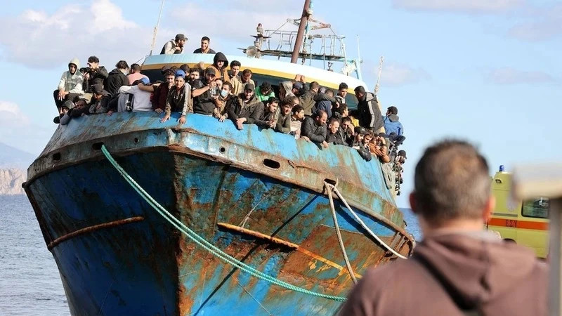 Illustrative image: Migrants stand on a fishing boat at the port of Palaiochora during a rescue operation off the island of Crete, Greece, on November 22, 2022. (Photo: REUTERS)