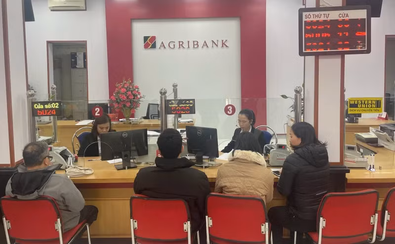 Customers make transactions at an Agribank branch.