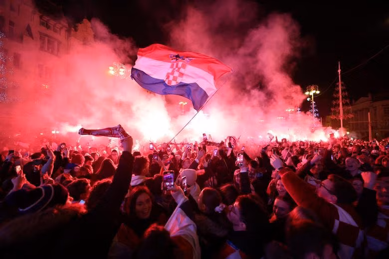 Croatia fan with flares in Ban Josip Jelacic Square celebrate in Zagreb after the match as they finish in third place. (Photo: REUTERS)