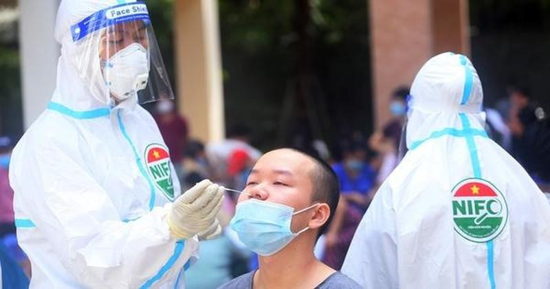 A health worker collects sample for COVID-19 testing.