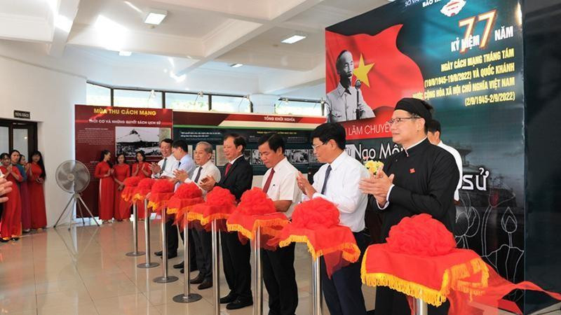 Delegates cut a ribbon to open the exhibition