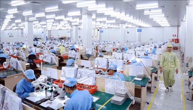 Production at Korean-invested YPE Vina Company at Binh Xuyen 2 IP in Vinh Phuc province. (Photo: VNA)