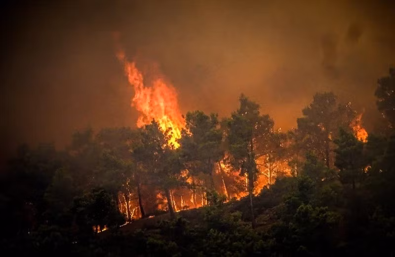 Smoke rises from a forest fire on the Greek island of Rhodes on July 22, 2023. (Photo: Reuters).