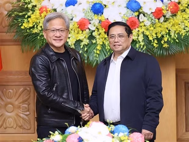 Prime Minister Pham Minh Chinh and President and CEO of Nvidia. (Photo: VNA)