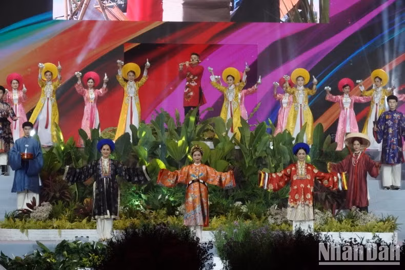 Models perform the Ao Dai collection "Natural Colour" by Designer Nguyen Duc Huy.