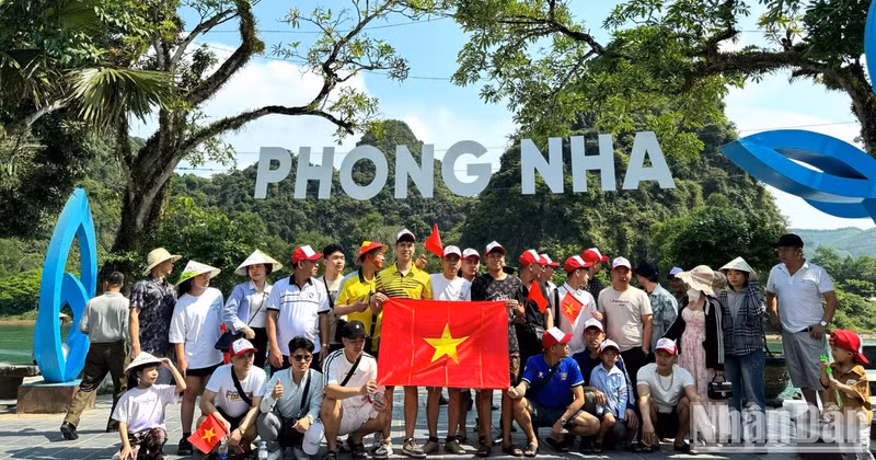 Tourists capturing memories before embarking on boat tours to Phong Nha and Tien Son caves