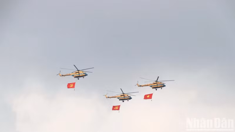 Helicopters with the Party and National Flags soar above Bien Hoa City, Dong Nai.