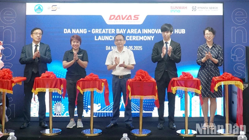 Delegates cut the ribbon to launch the innovation hub.
