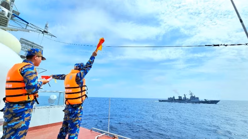 The two navies conduct hand flag training during the joint patrol.