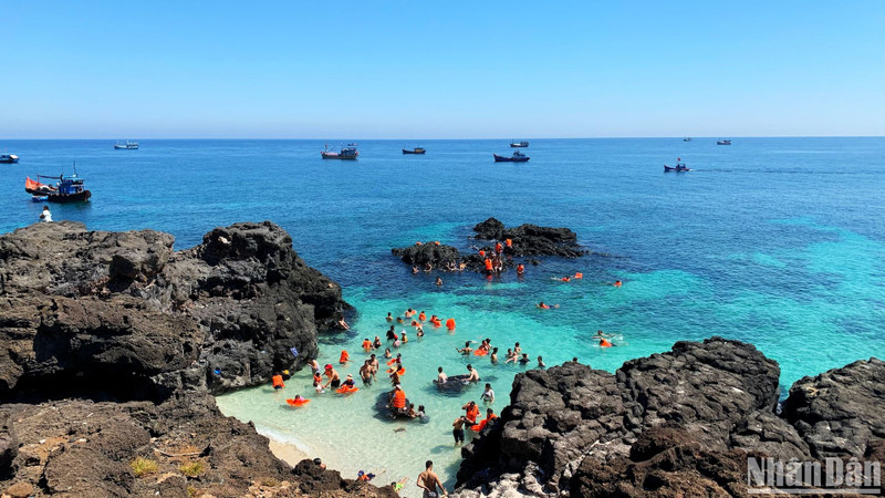 A visitor relaxing amid the stunning natural surroundings of An Binh Island.