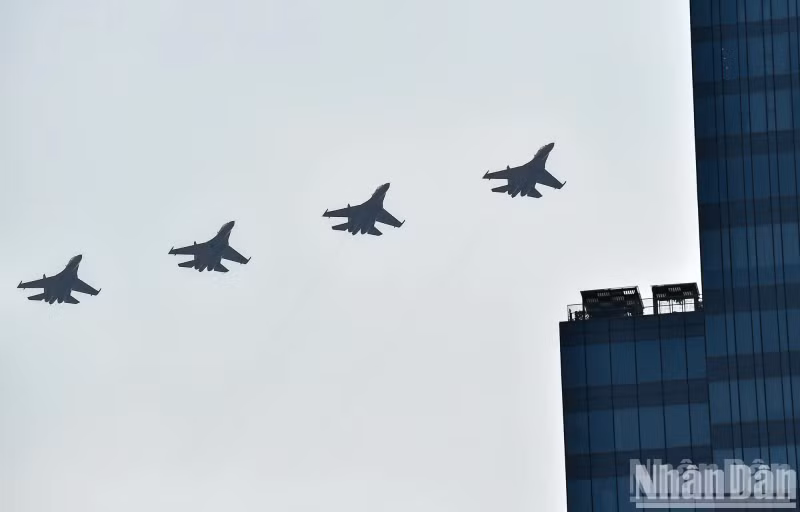 Fighter aircrafts executing an aerial formation.