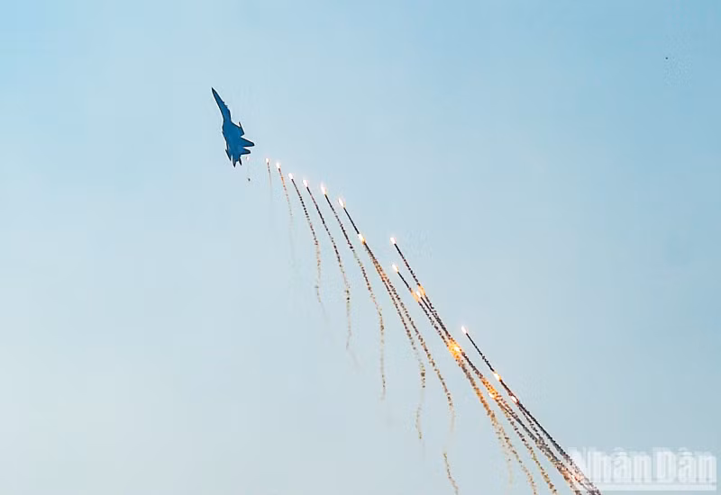 Su-30MK2 fighter jets fire flares in air show above central Ho Chi Minh City