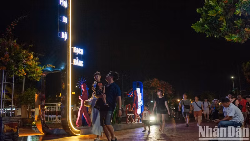 People and tourists at Bach Dang walking street.