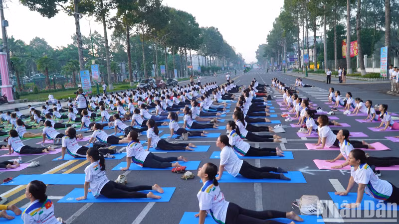 People performing Yoga exercises at the event.