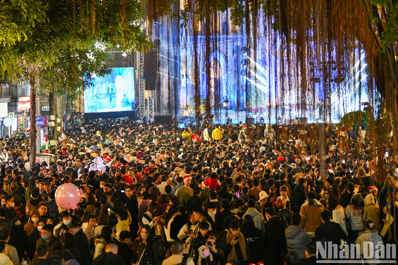 Hanoi locals gather at Saint Joseph Cathedral on Christmas Eve.