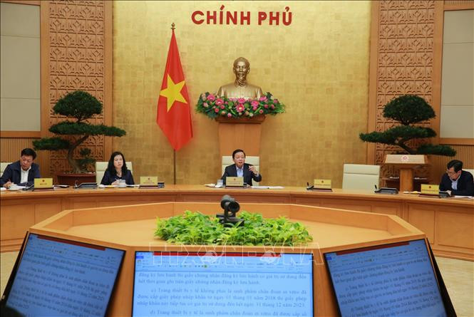 At the working session (Photo: VNA)