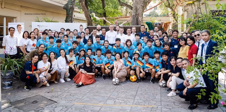 Delegates pose for a group photo at the event 