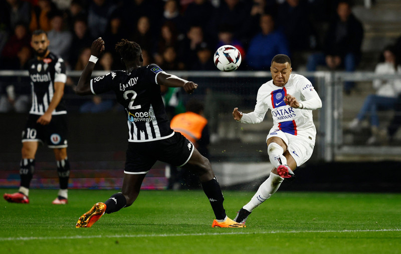 Paris St Germain's Kylian Mbappe in action with Angers' Batista Mendy - Ligue 1 - Angers v Paris St Germain - Stade Raymond Kopa, Angers, France - April 21, 2023. (Photo: Reuters)