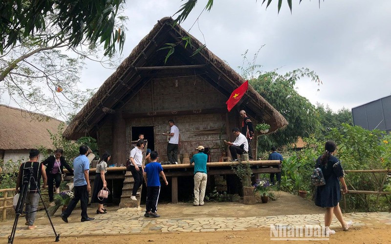 Tourists visit the Cultural Village.