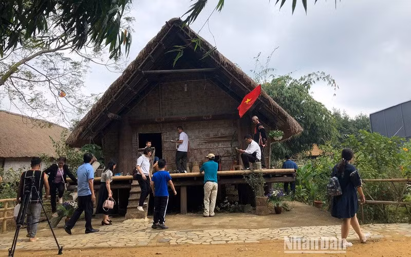 Tourists visit the Cultural Village.