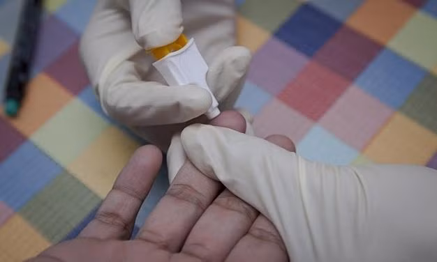 A person receives an HIV test in Vietnam. Photo by UNAIDS.