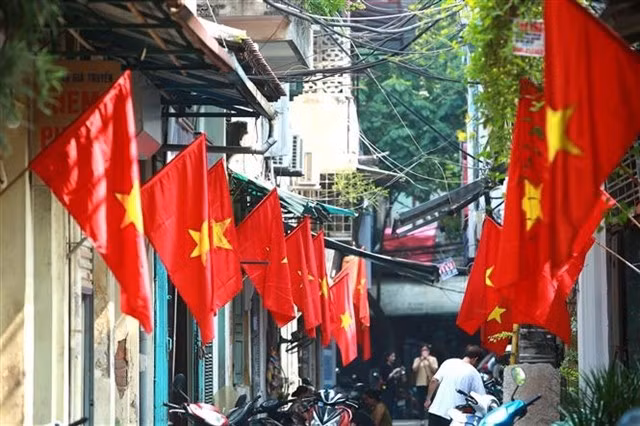 Every year, many streets in Hanoi are decorated with national flags to celebrate the National Day holiday. (Photo: VNA)