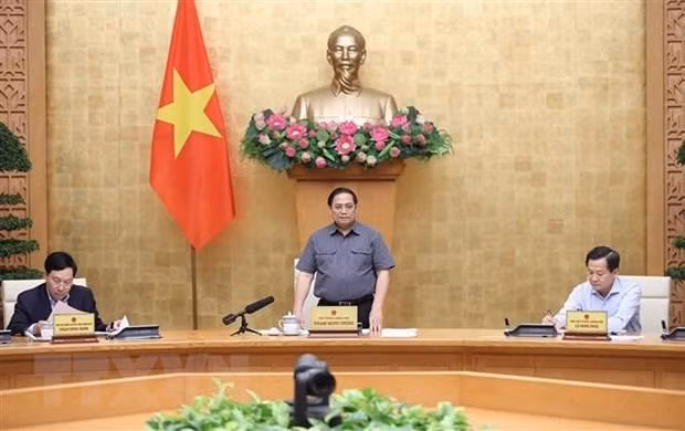Prime Minister Pham Minh Chinh speaking at the meeting. (Photo: VNA)