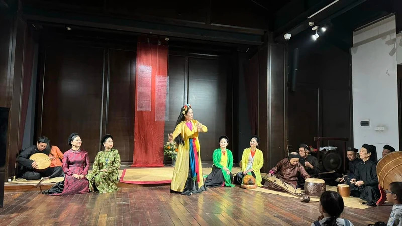 Performing traditional arts in the Hanoi's Old Quarter space.