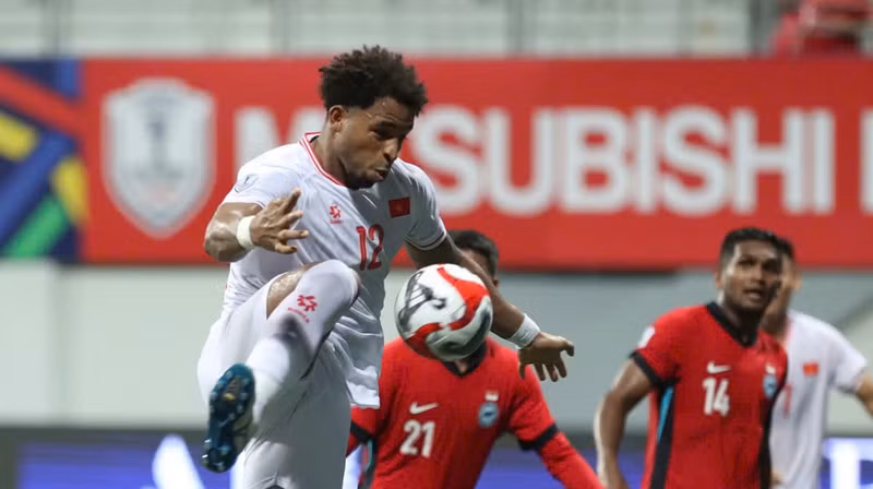 Forward Xuan Son in action during the match.