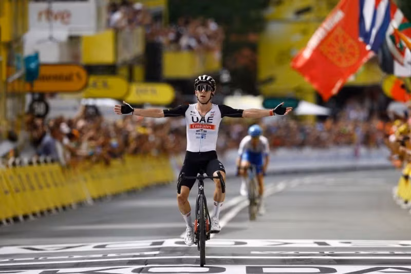 UAE Team Emirates' Adam Yates celebrates as he crosses the finish line to win stage 1 - Cycling - Tour de France - Stage 1 - Bilbao to Bilbao - Spain - July 1, 2023. (Photo: Reuters)