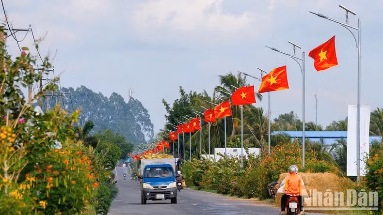 Flag line on National Highway 54 through Cau Ke District, Tra Vinh Province.