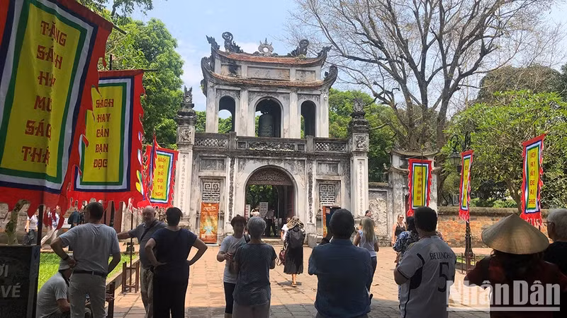 Foreign tourists visit the Temple of Literature, Hanoi.