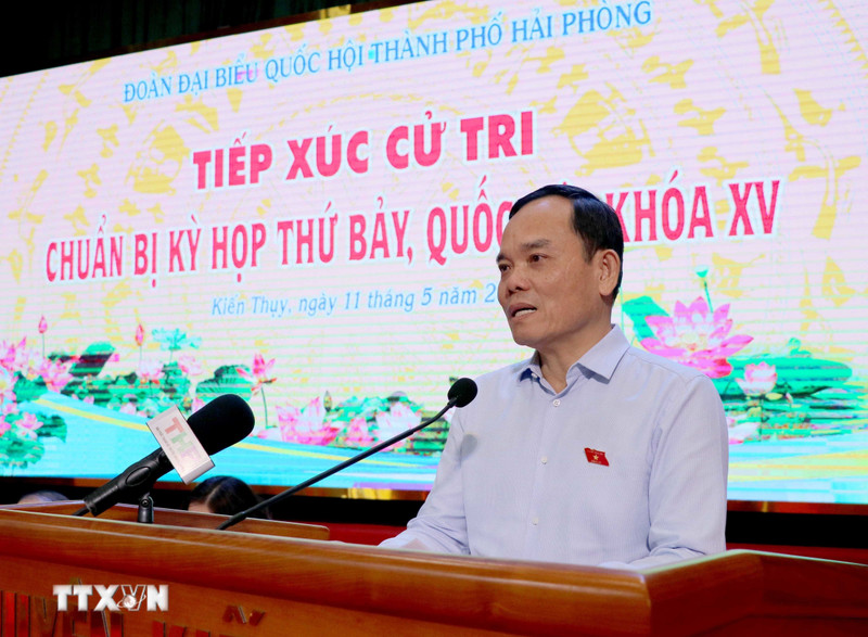 Deputy Prime Minister Tran Luu Quang speaking at the meeting with voters in Hai Phong city (Photo: VNA)